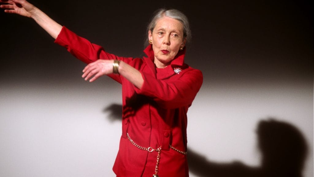 A woman wearing a red suit. 