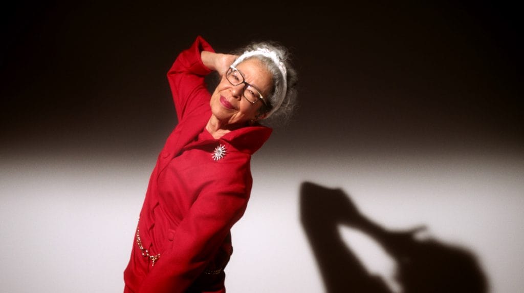 A woman wearing a red suit. 