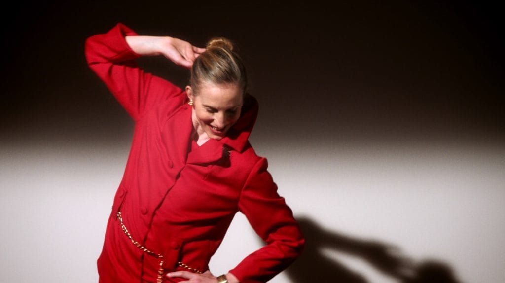 A woman wearing a red suit. 