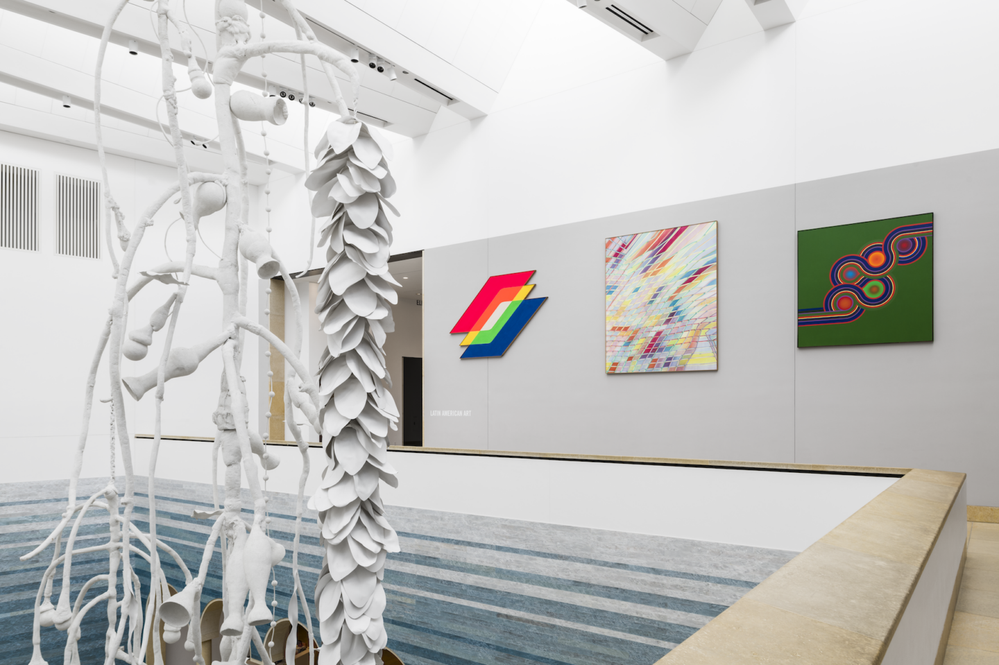 Wide shot of a view of Siphonophora from the Mezzanine along with three other works of art.