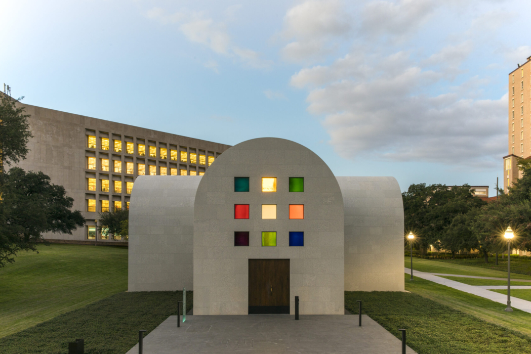 Early evening exterior wide shot of Austin by Ellsworth Kelly towards the entrance. The Perry-Castañeda Library can be seen in the distance behind the building.