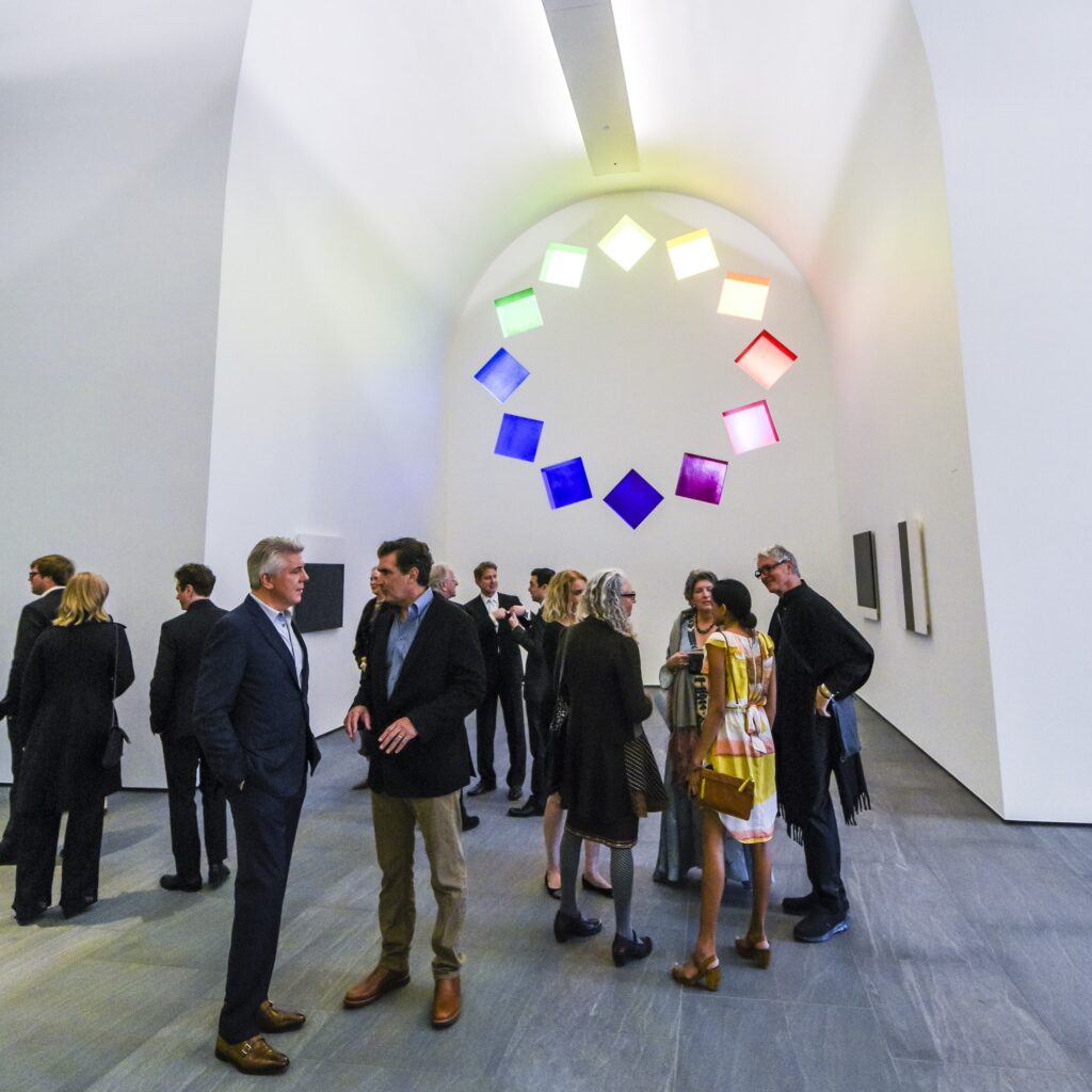 Dressed up museum patrons inside Austin by Ellsworth Kelly during an museum event.