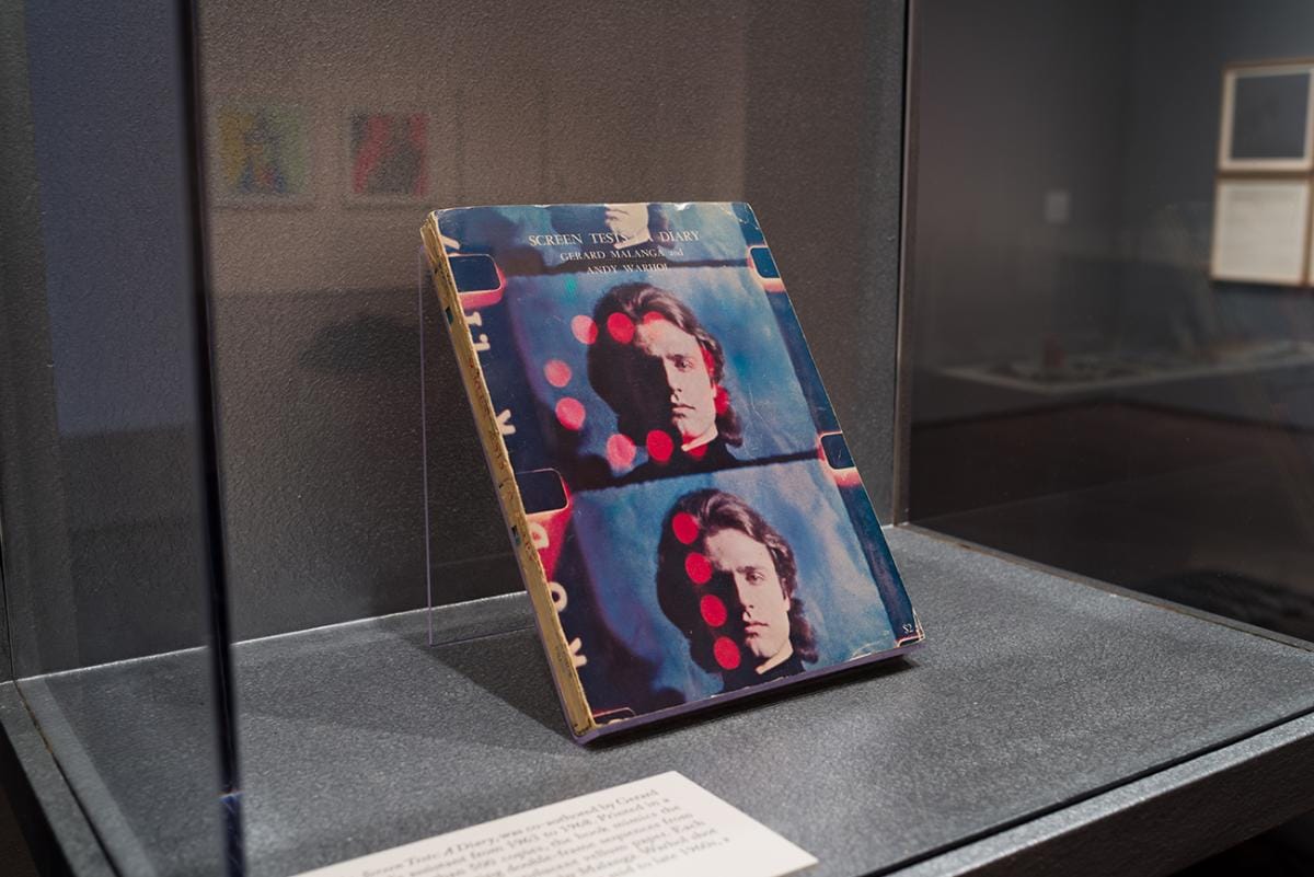 A printed book in a display case.